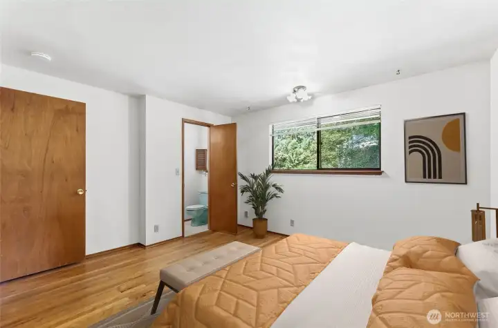 Primary bedroom features a half bath.  That's novel for a 60's house!