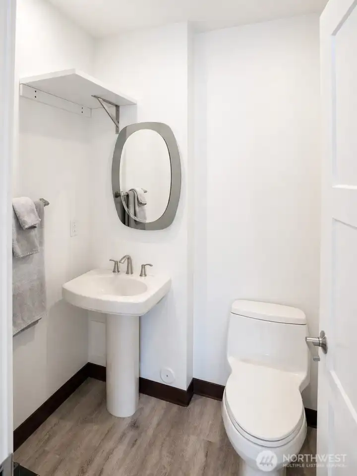 Half Bath off Gym in Main Home Garage Bay