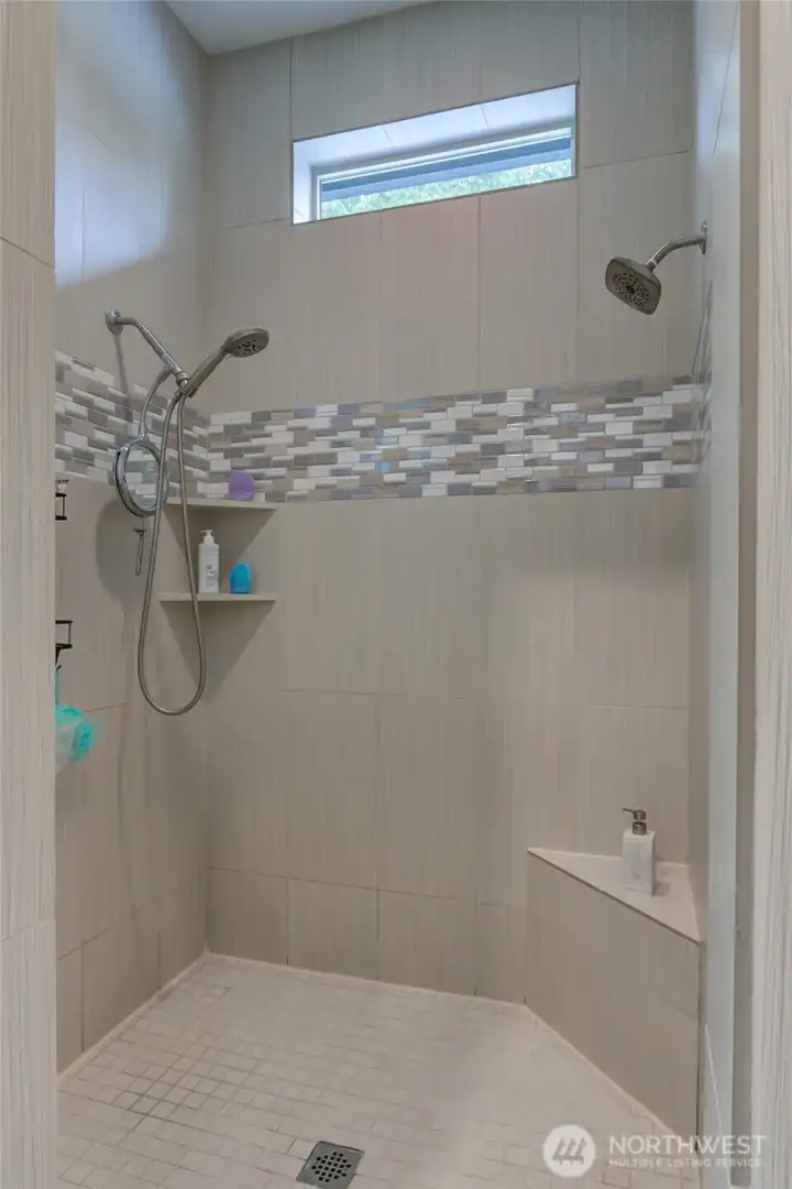 Step in shower complete with seat - for those mornings that come too early to stand