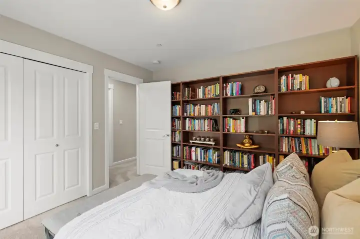 Guest bedroom #2 with shelving.