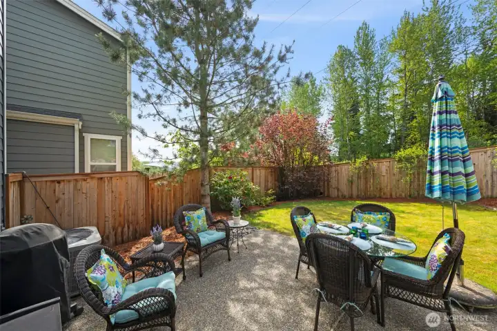 Sunny, fully fenced back yard overlooks walking trail.