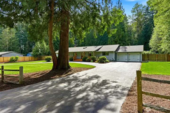 Oversized circular driveway with plenty of parking.