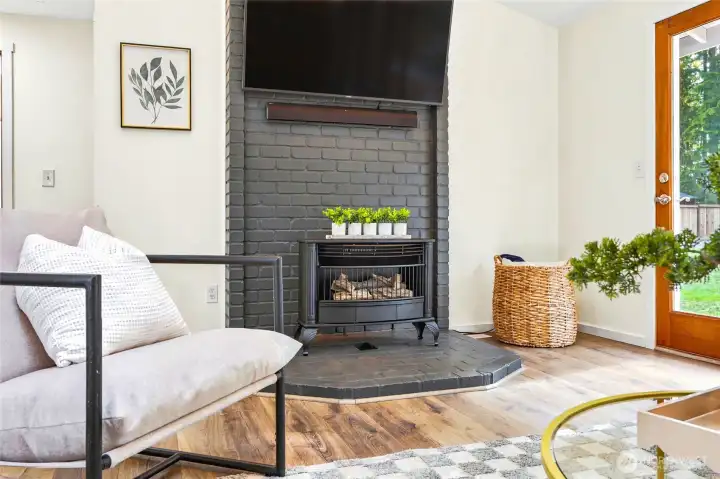 Cozy gas fireplace adds warmth and character to the living room.