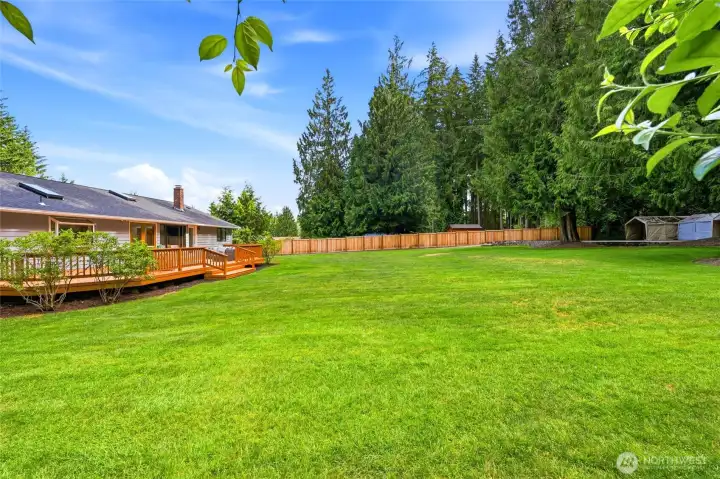 Expansive level lawn provides endless possibilities for recreation, gardening, play, or future outdoor projects.