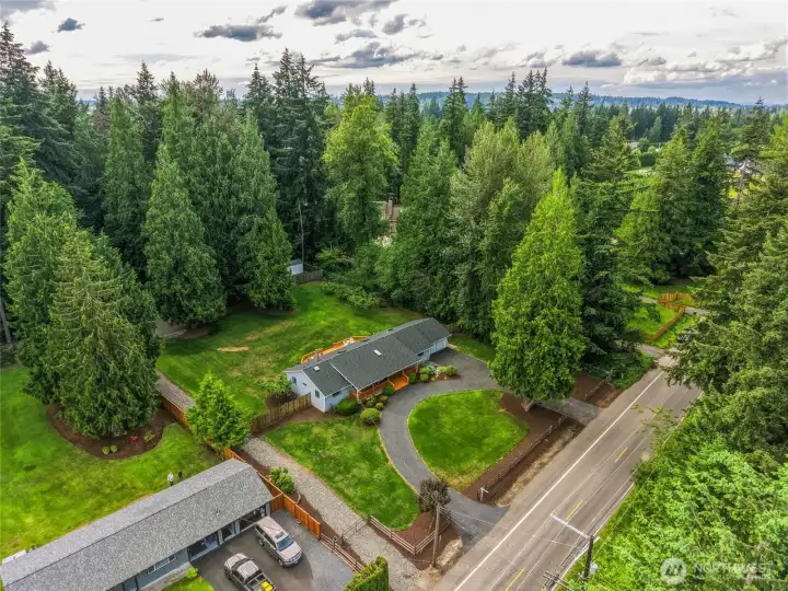 Backyard backs to adjacent water district property, providing added privacy and a beautiful natural backdrop of mature trees.