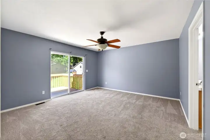 Primary bedroom with deck access, large closet and full primary bath.