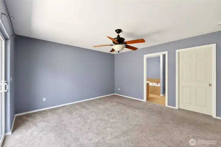Primary bedroom.  Walk in closet door is closed.