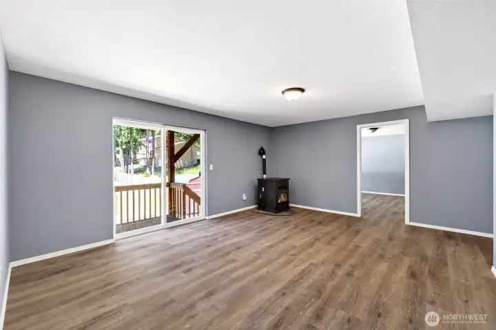 Family room with back yard access downstairs. Pellet stove.