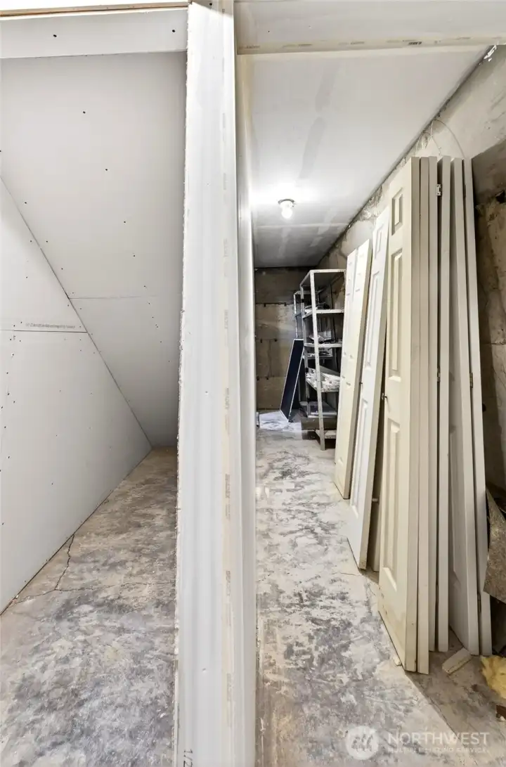 Loads of storage next to and under the stairwell.