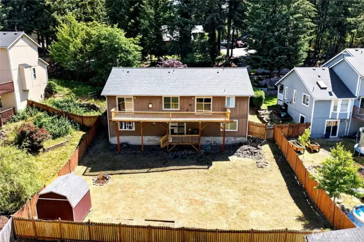 Fully fenced, with gates. large outbuilding and 2 decks!