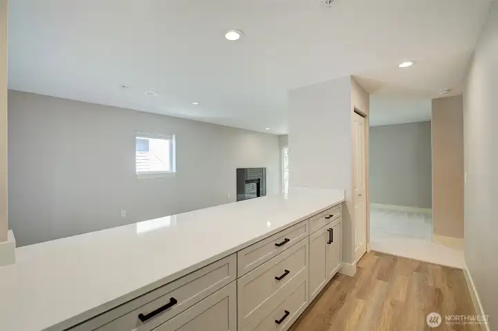 This kitchen is over-sized for a condo. Tons of counter-space, an eat-in counter as well as lots of panty space.