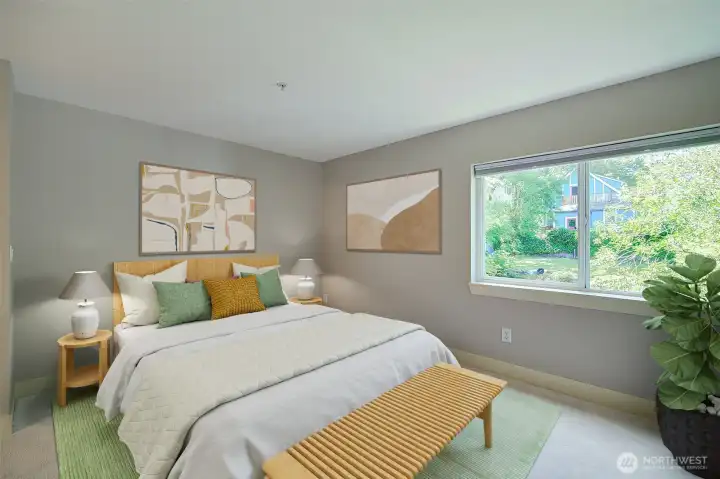Bedroom is at the back of the building so it is quiet. Two closets and great views of greenery. Room is virtually staged.