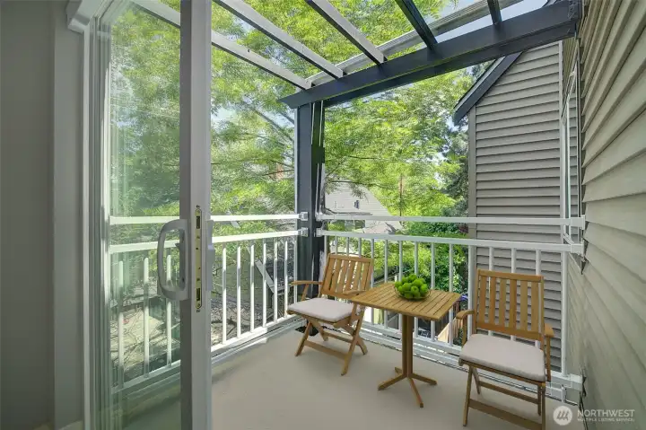 One of two decks. This one is east facing and perfect for your morning coffee or for a cool spot to hang in the late afternoon. Deck is virtually staged.