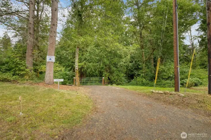 A gated entry adds privacy, while generous parking outside the gate welcomes guests and contractors with ease. A gated entry adds privacy, while generous parking outside the gate welcomes guests and contractors with ease.