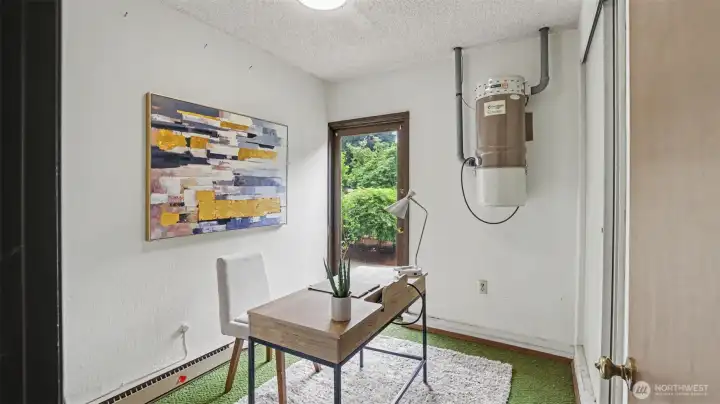 Versatile utility room that can easily serve as a home office and opens directly to the backyard. Versatile utility room that can easily serve as a home office and opens directly to the backyard.