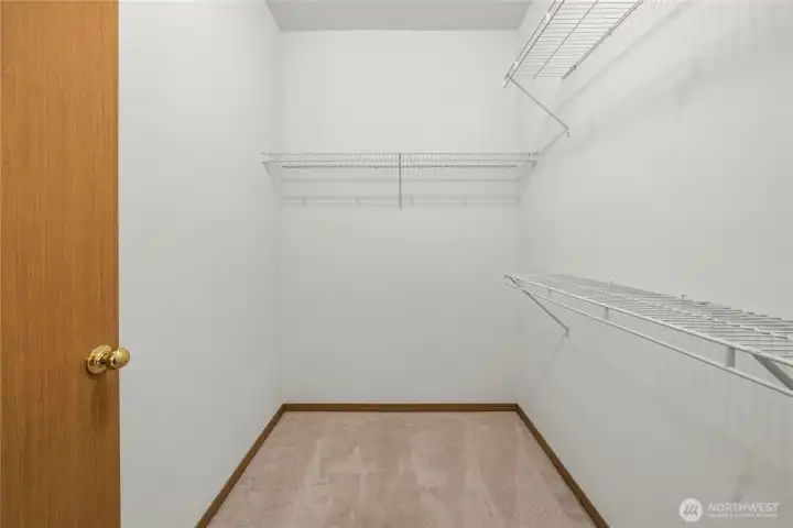 Primary walk-in closet. Primary walk-in closet.