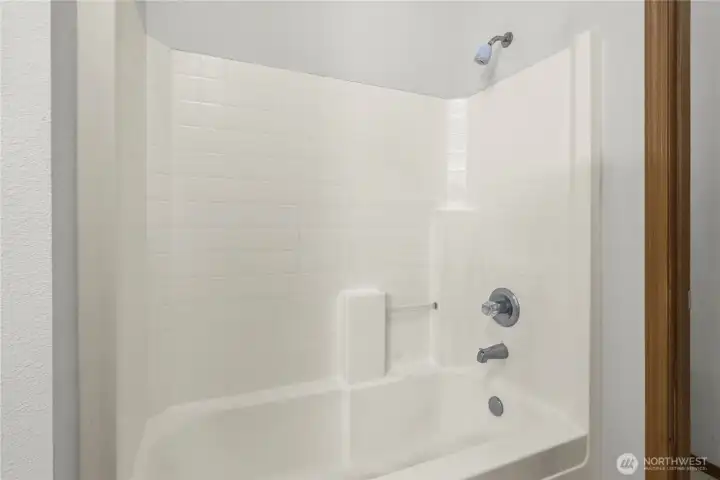 Primary bathroom - tub shower combo. Primary bathroom - tub shower combo.
