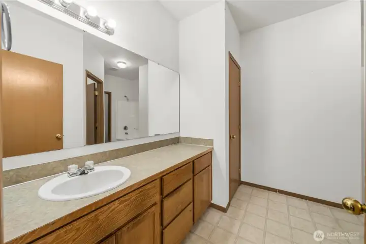 Primary bathroom with tub and shower. Primary bathroom with tub and shower.