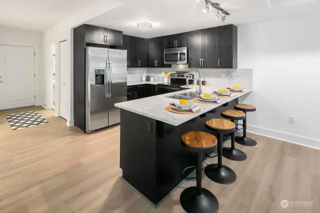 Fun to sit at the breakfast bar for quick meals or chat with the cook.  Four stools easily fit.