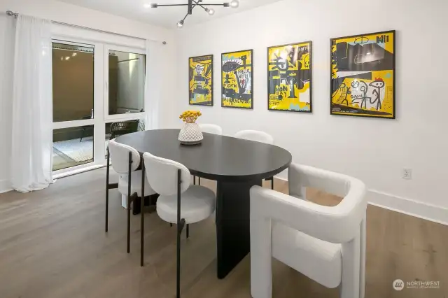 Dining area can accommodate an expanding table for large groups.  New light fixture adds a modern look.  Expansive walls are perfect for art work display.