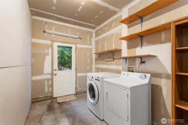 Laundry room has been added to the garage.  Finish or remove the wall to have full garage access.