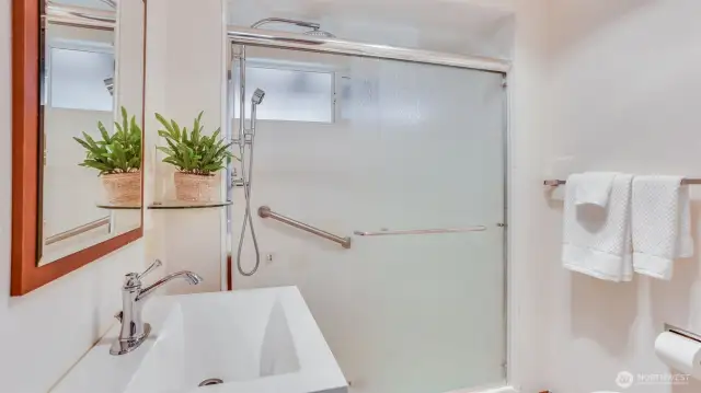 Beautifully designed shower room featuring modern finishes and a second sink in this primary ensuite.