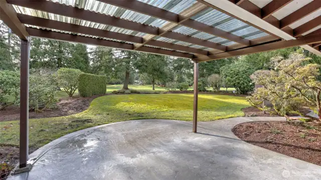 Enjoy sitting out here looking out to the golf course year round with this covered patio space.