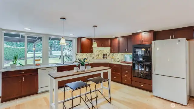 Well-appointed and open kitchen with space for island or smaller dining space —perfect for casual meals and morning coffee.