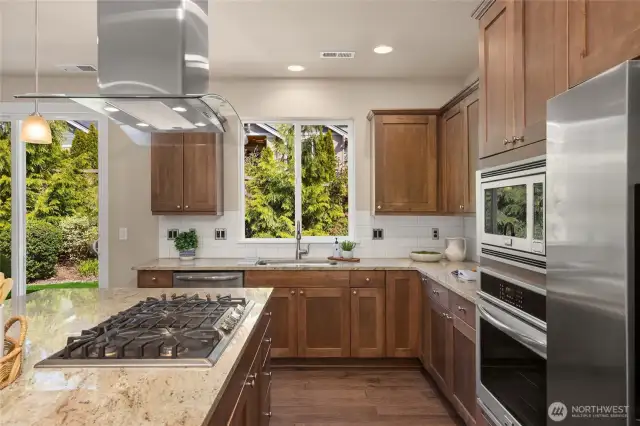 The kitchen has sweet kitchen sink views out to the private backyard.
