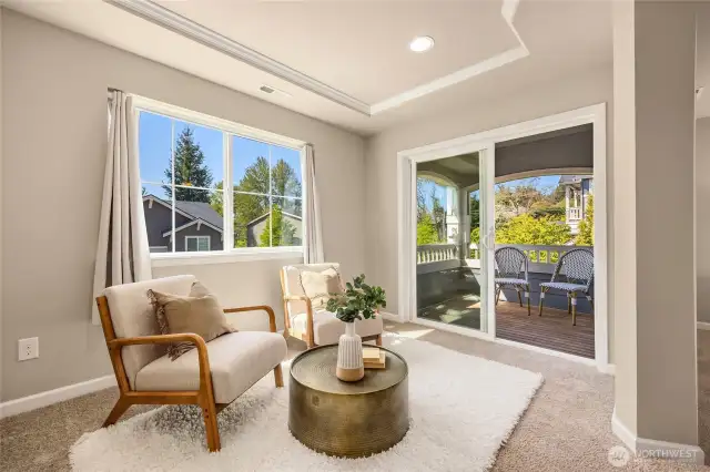 The sitting area in the primary could also be a home office or workout area.