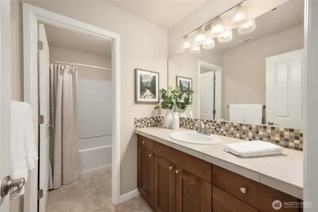 The main hallway bathroom upstairs with a tub and shower combo.