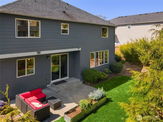 An aerial look at the backyard with mature plantings.