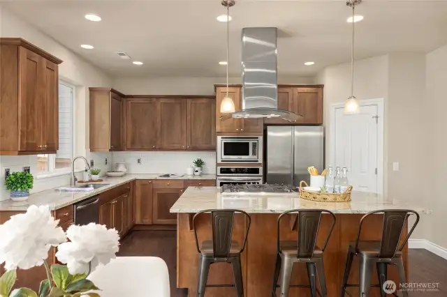 This pretty kitchen has ample cabinetry storage and a walk-in pantry.