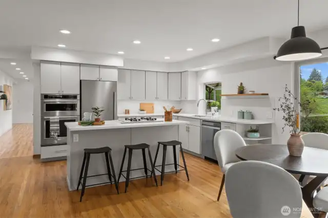 Newly remodeled kitchen with gas cooking and breakfast bar is a dream for preparing meals while entertaining guests, hosting summer parties, and baking desserts for holiday gatherings.