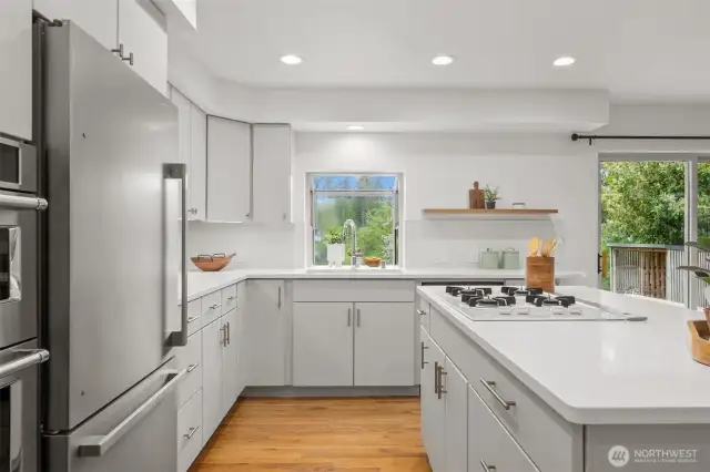 Just what you've been waiting for! Sprawling quartz counters, two pantries, and new stainless steel appliances with an air fryer, microwave, and oven all in one.