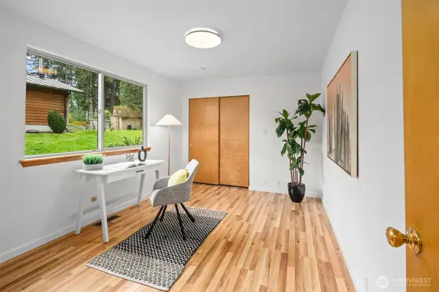 Separate from the primary suite, this main level bedroom is fantastic for a bedroom or an office.