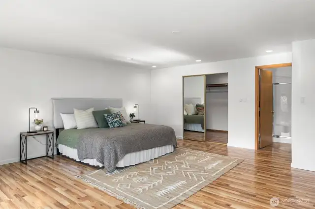 After a day on the water, retreat to your stylish primary suite with 5 piece bath, amazing walk-in closet, gas fireplace, and a stunning view.