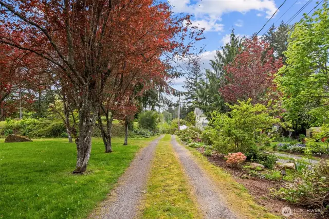 Beautifully landscaped with private drive to gated entry.