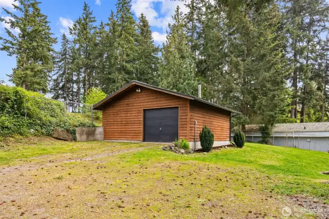 Newer metal roof on garage, all insulated, 240v, tons of outlets, and a new wood stove installed in 2021.