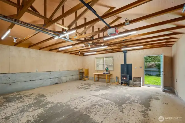 The oversized 2+ car garage is perfect as a studio for woodworking or your favorite hobbies. Stay super warm all year long with the newly installed wood stove.