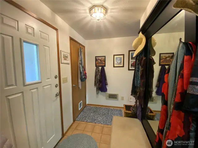 Entry door on left, garage door next with pet door