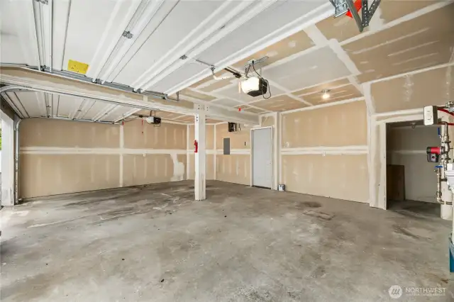 Gigantic 2 car garage with an extra storage area to the right. It is rare to find a garage this spacious with this much storage!