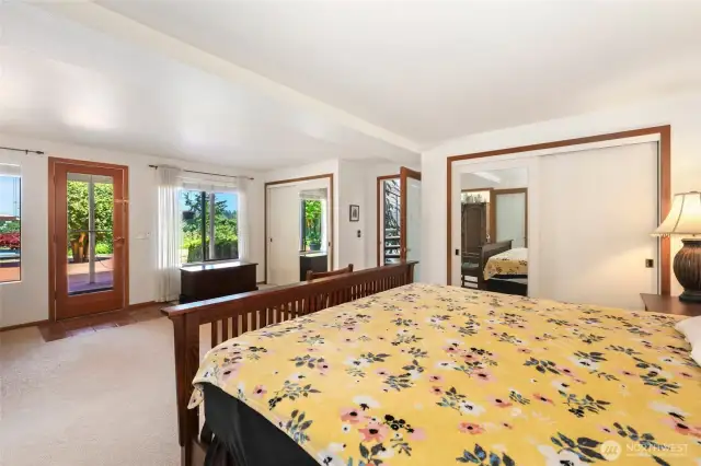 Primary room down stairs with access to front yard and pool and views