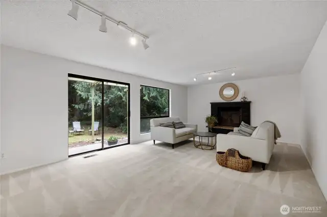Second living room on the main floor with fireplace.