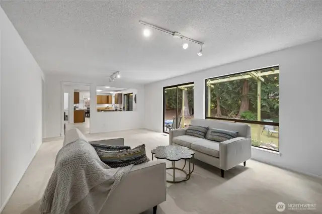 2 sets of sliding glass doors lead out to the back yard.