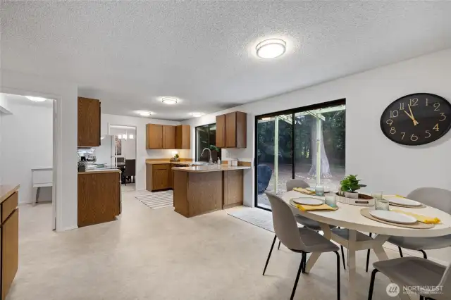Spacious kitchen with eat-in dining area.