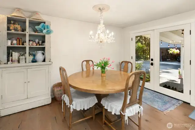 Dining room with French doors to DADU and big backyard.