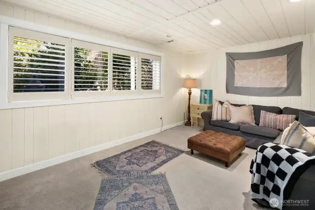 Downstairs living room w/wood burning fireplace
