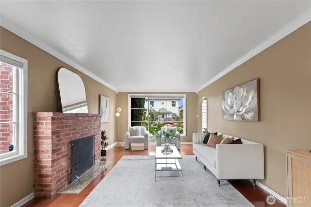 A view from the back of the living room, with a large picture window facing the front of the house