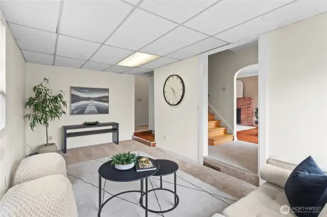 A sunken in family room to be used for entertaining, a play room, or home office